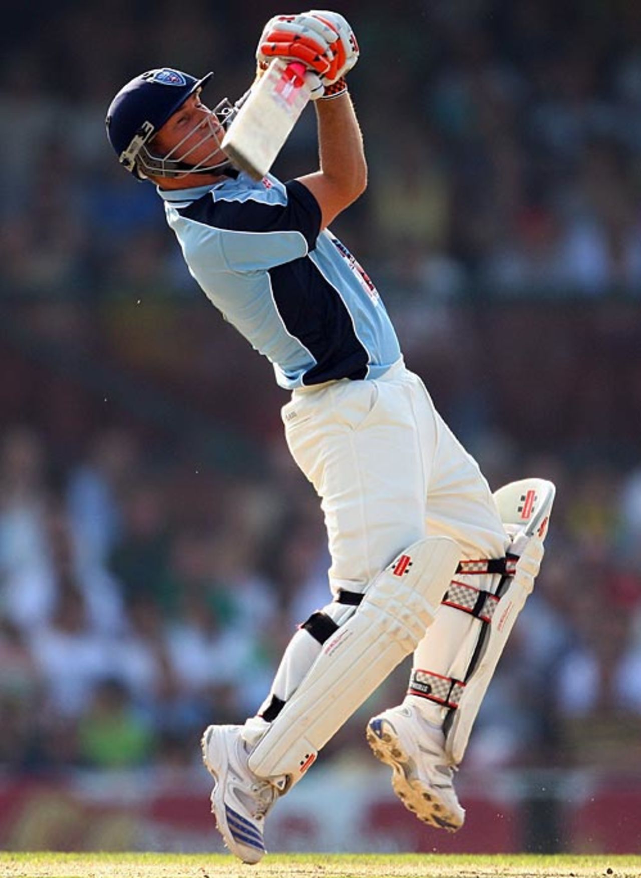 David Warner plays an upper cut during the bushfire appeal charity match, Sydney, February 22, 2009