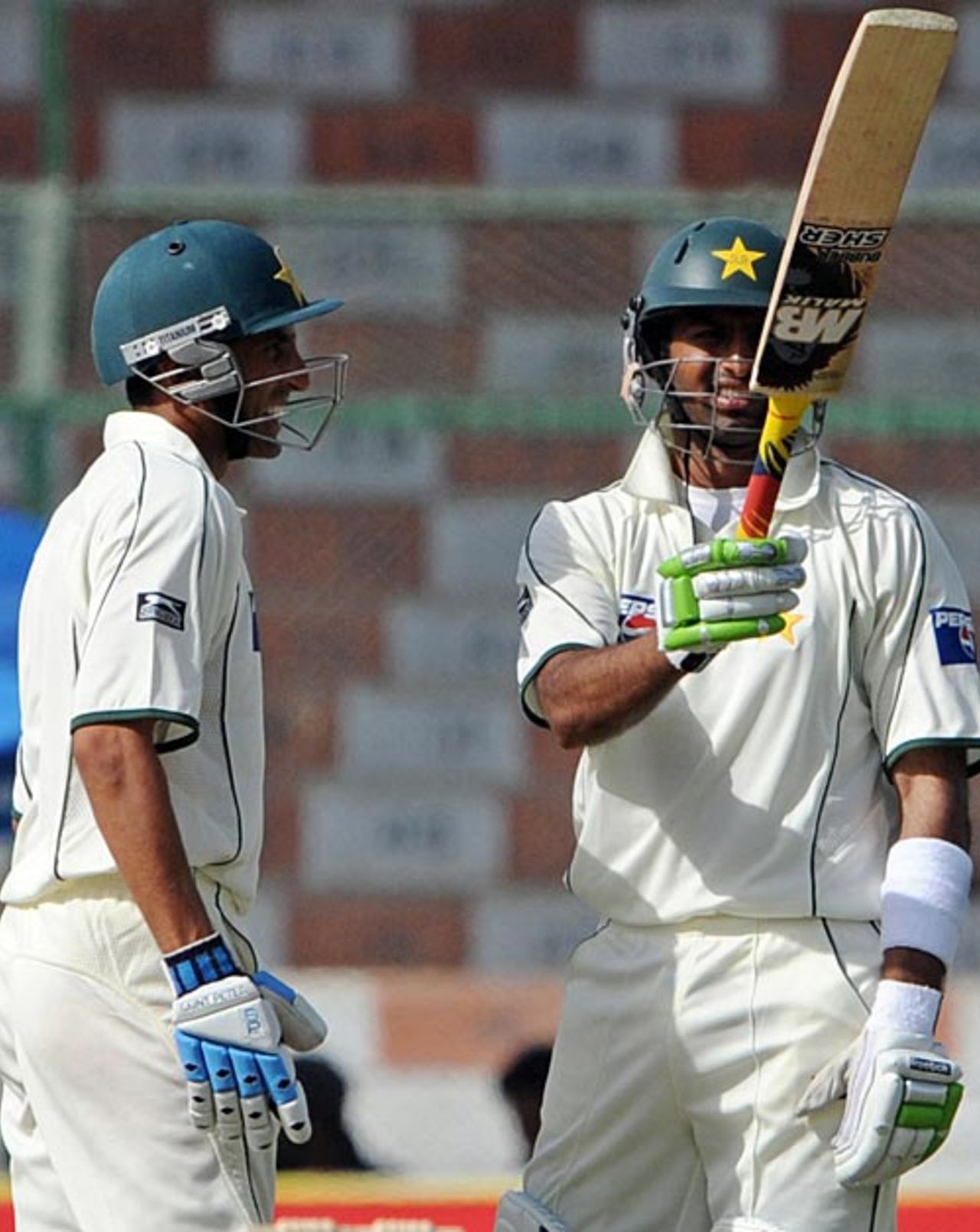 Shoaib Malik raises his bat on getting to fifty, Pakistan v Sri Lanka, 1st Test, Karachi, 3rd day, February 23, 2009