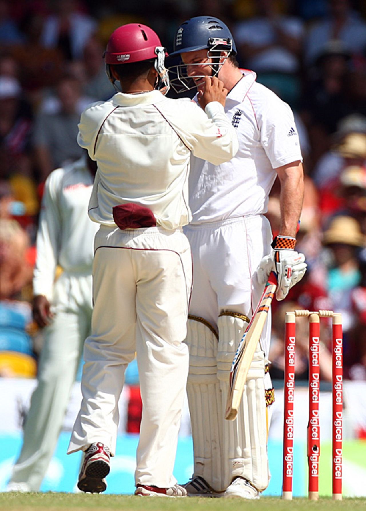Ramnaresh Sarwan retrieves the ball ... from inside Andrew Strauss's helmet, West Indies v England, Barbados, 4th Test, February 26, 2009