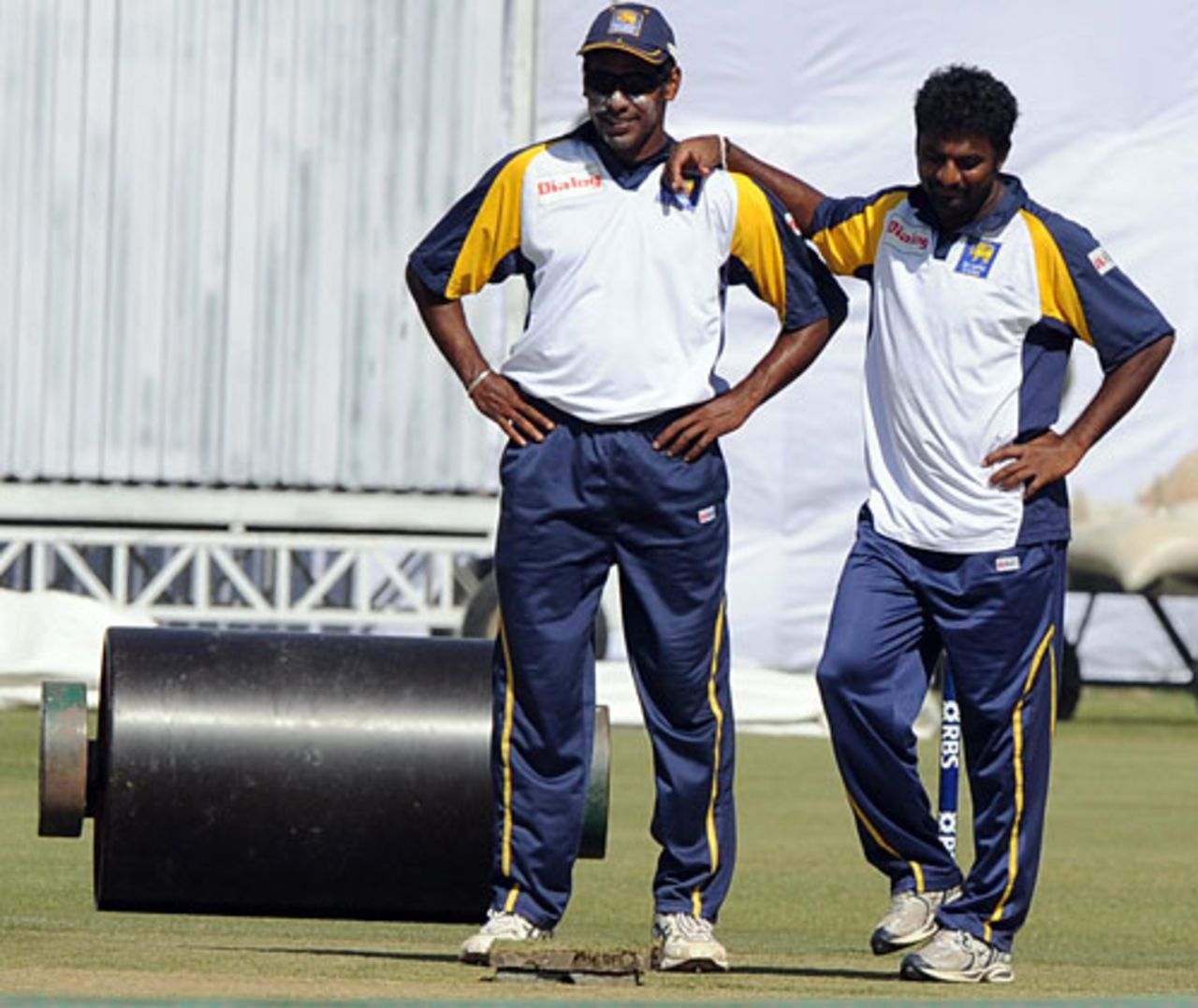Chaminda Vaas and Muttiah Muralitharan have a look at the pitch on the eve of the second Test, Lahore, February 28, 2009