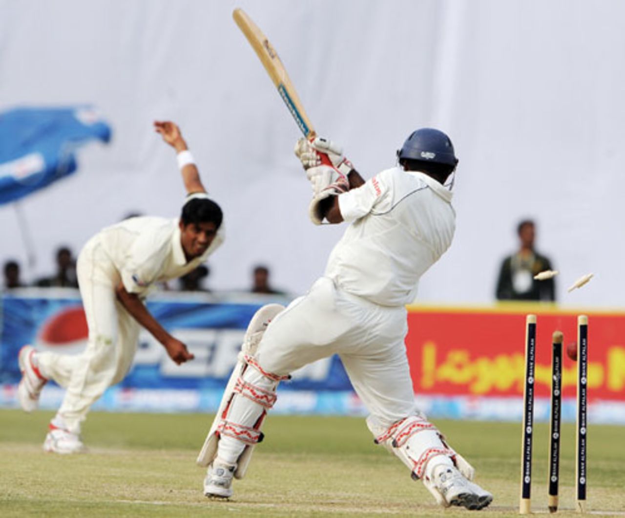 Muttiah Muralitharan's middle stump is rocked back by a Mohammad Talha delivery, Pakistan v Sri Lanka, 2nd Test, 2nd day, March 2, 2009