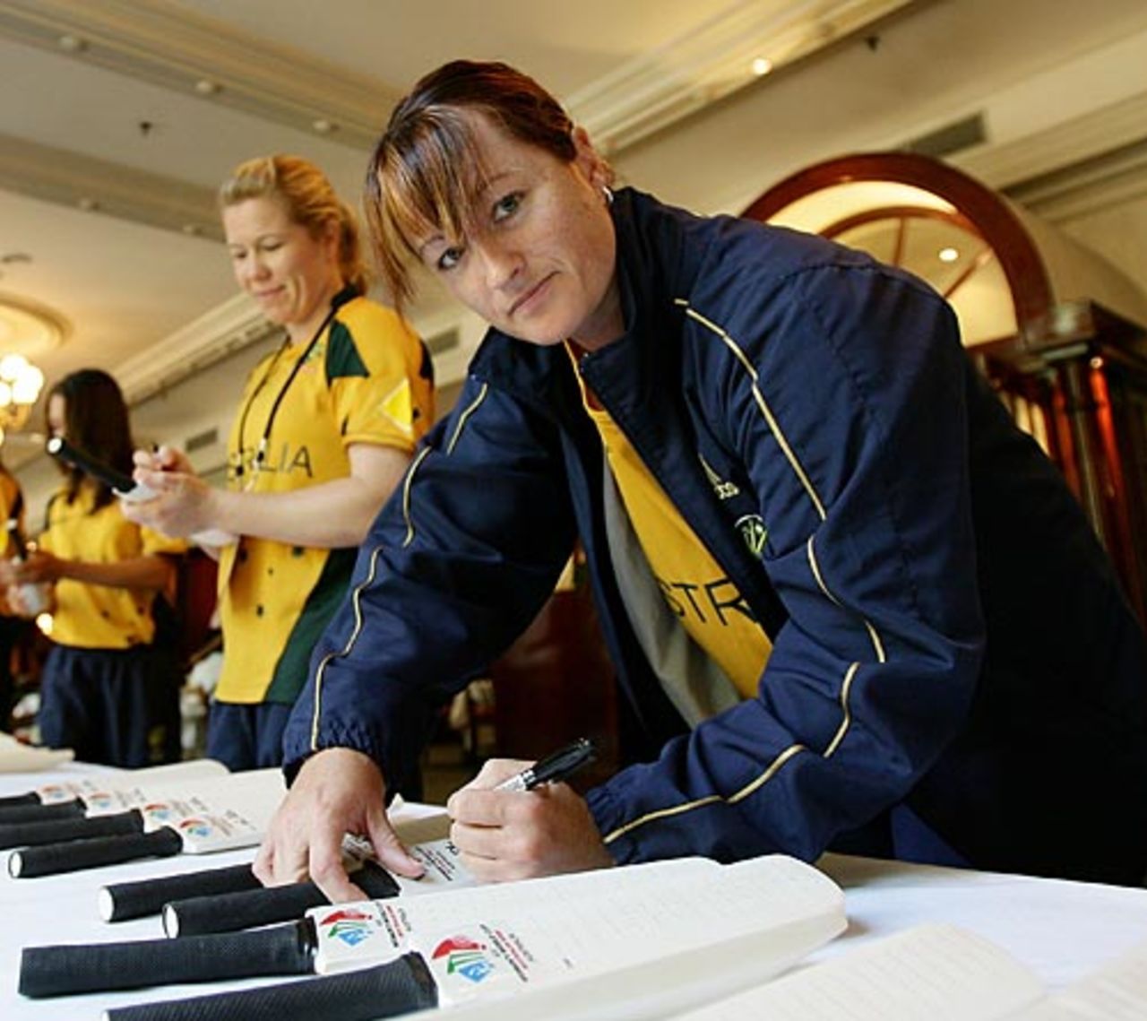 Karen Rolton signs bats, women's World Cup, Sydney, March 3, 2009