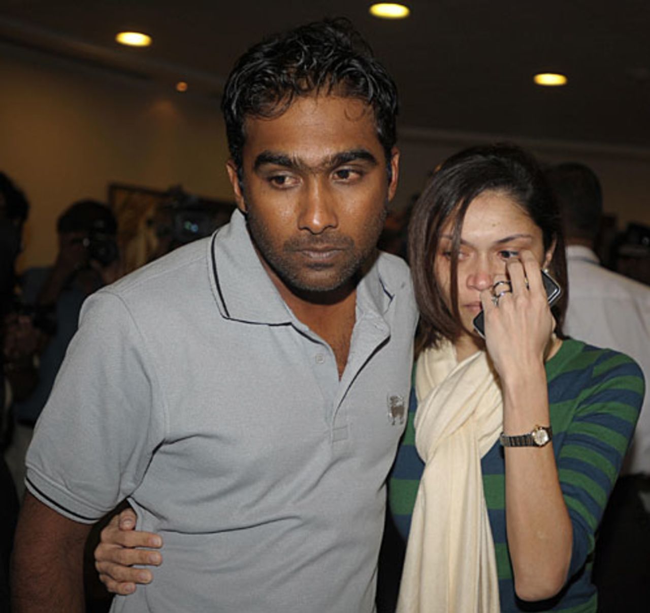 Mahela Jayawardene and his wife Christina leave the airport, Colombo, March 3, 2009