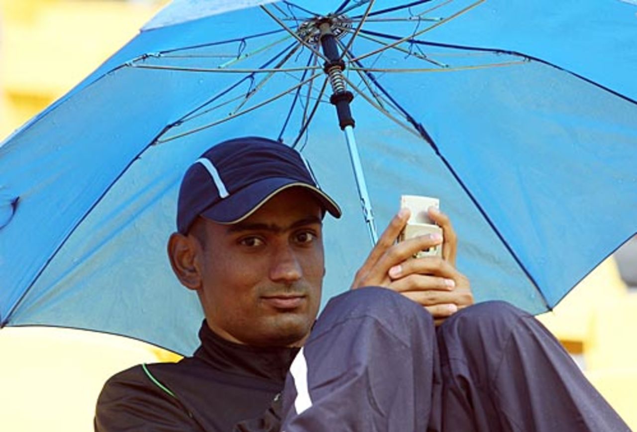 A spectator sits under his umbrella, New Zealand v India, 2nd ODI, Westpac Stadium, Wellington, March 6, 2009