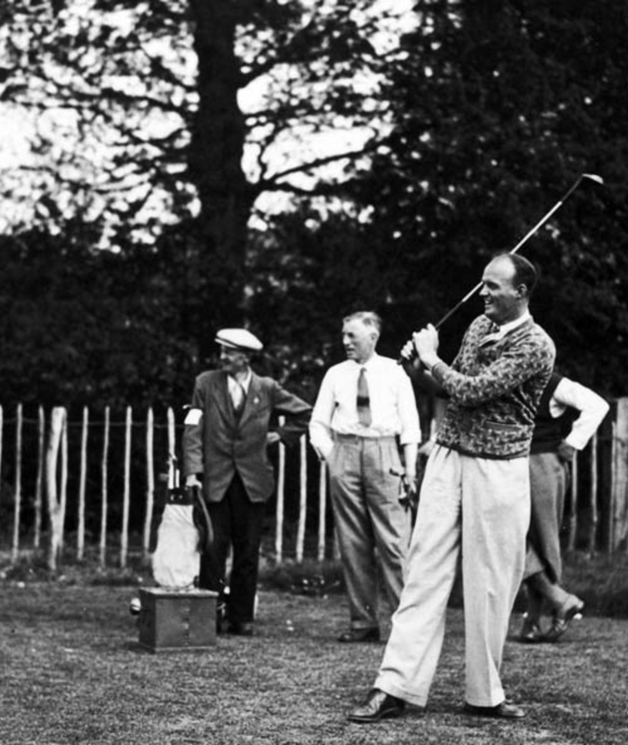 Bill O'Reilly tees off at the West Kent Golf Club, Bickley, May 23, 1938