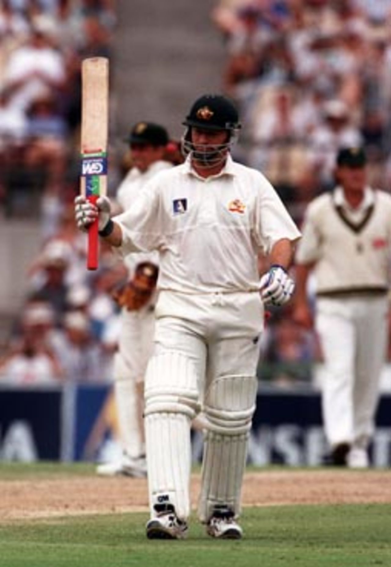 Steve Waugh raises his bat on reaching 50 in his 100th Test ..Australia v South Africa, 2nd Test Day 3 at the SCG, Sunday January 4th 1998.