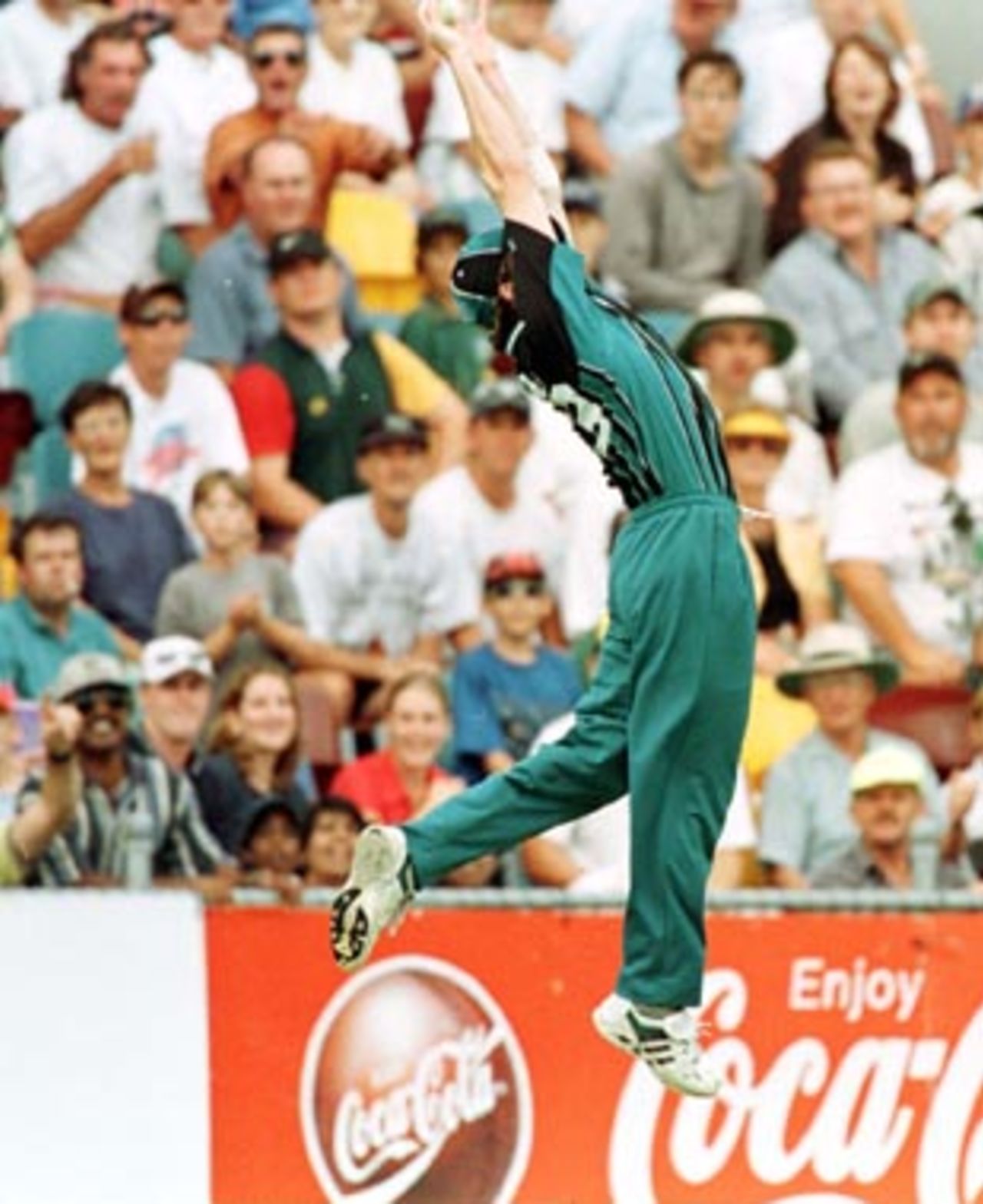 Dion Nash takes a sensational catch on the border from Cronje off O'Connor but he was forced to throw the ball away as he fell over the rope...South Africa v New Zealand ODI at the 'Gabba, Brisbane, Friday January 9th 1998.