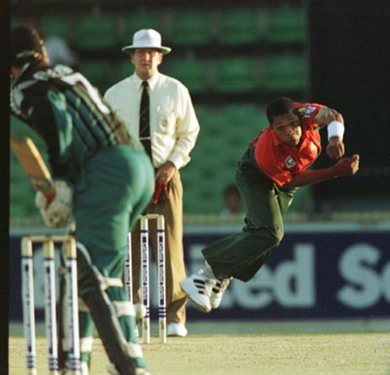Makhaya Ntini airborne as he throws himself into his bowling during his first over of his first ODI for South Africa.....South Africa v New Zealand ODI at the WACA, Perth, Friday January 16th 1998.
