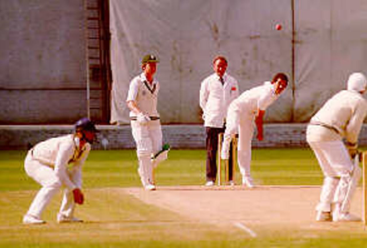 Rodney Ontong bowling against Worcestershire at The Gnoll, Neath in 1987. Alan Whitehead is the umpire and Tim Curtis the non-striking batsman.