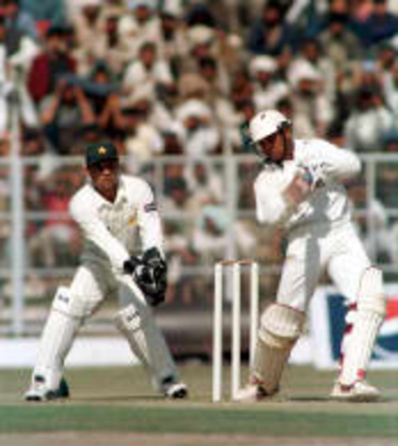 Indian batsman Jacob martin drives Wasim Akram as Moin Khan reacts. India 'A' v Pakistan Roop Singh Stadium, Gwalior, 24 January 1999