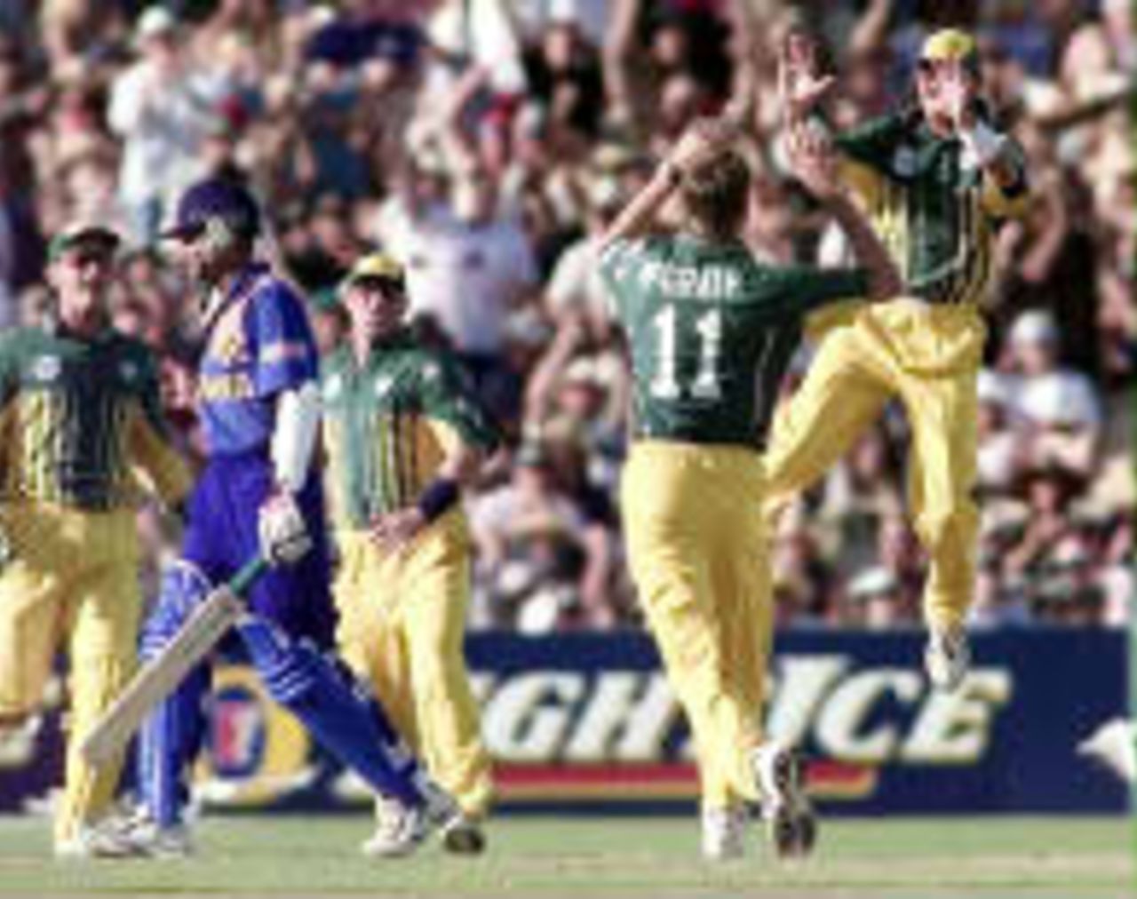 Greg Blewett leaps in air as Glenn McGrath dismisses Marvan Atapattu, caught by Shane Warne in the slips for a duck. Australia v Sri Lanka, Carlton and United Series, Adelaide, 24 January 1999