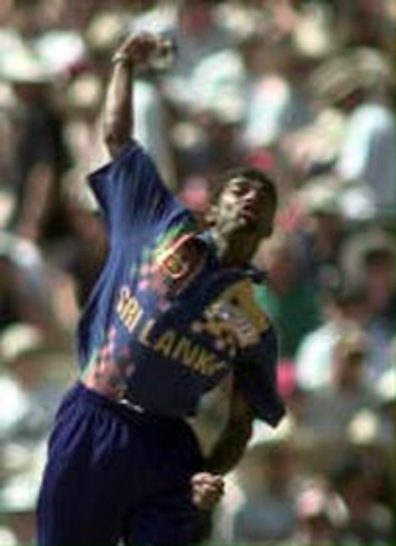 Sri Lankan bowler Muttiah Muralitharan, whose controversial action resulted in him being called for chucking the day before, bowls against Australia as the two teams play at the Adelaide Oval 24 January.