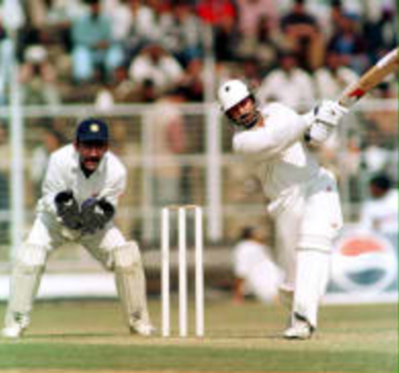 Saleem Malik reaches his century with a six   - Karim looks on.  Pakistan in India, 1998-99 India A v Pakistan Roop Singh Stadium, Gwalior 25 January 1999