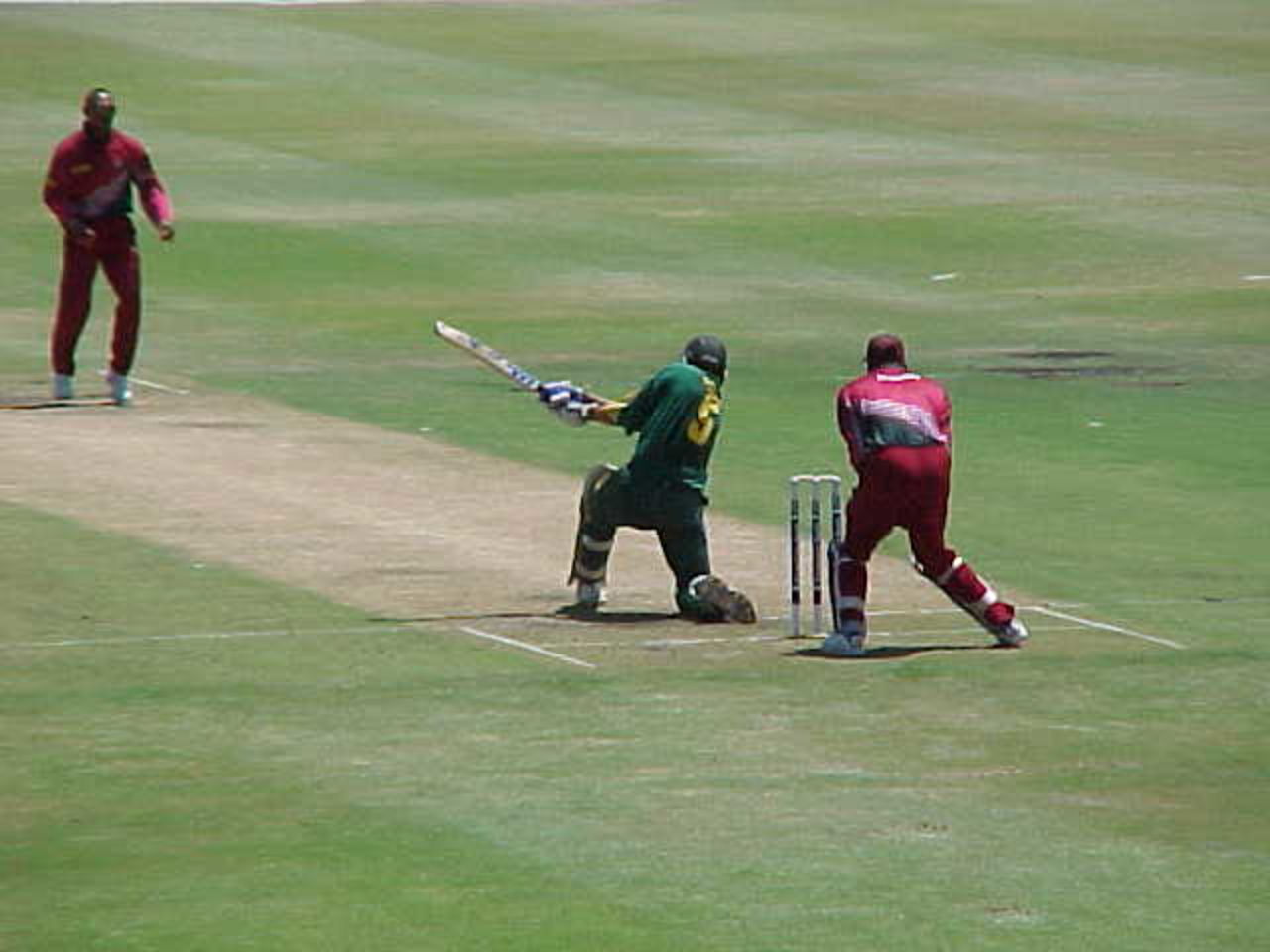 Cronje slog-sweeps during his 74 - West Indies in South Africa, 1998-99, 4th One Day International, South Africa v West Indies, St George's Park, Port Elizabeth, 30 January 1999.