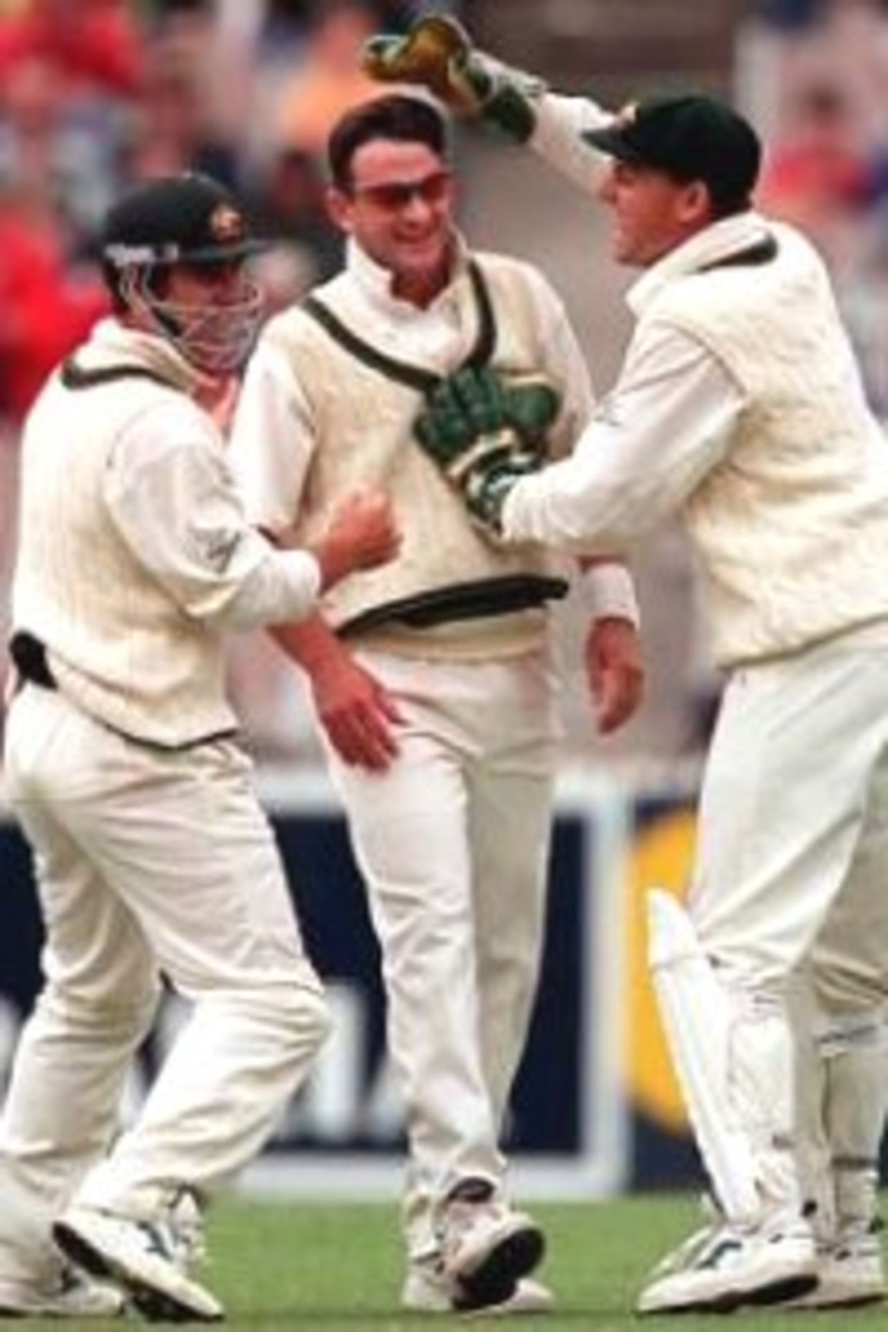 30 Dec 1999: Mark Waugh of Australia is congratulated by team mates after taking the wicket of MSK Prasad of India, on day five of the second test match between Australia and India at the Melbourne Cricket Ground, Melbourne, Australia. Prasad was out, caught by Shane Warne, bowled Mark Waugh.