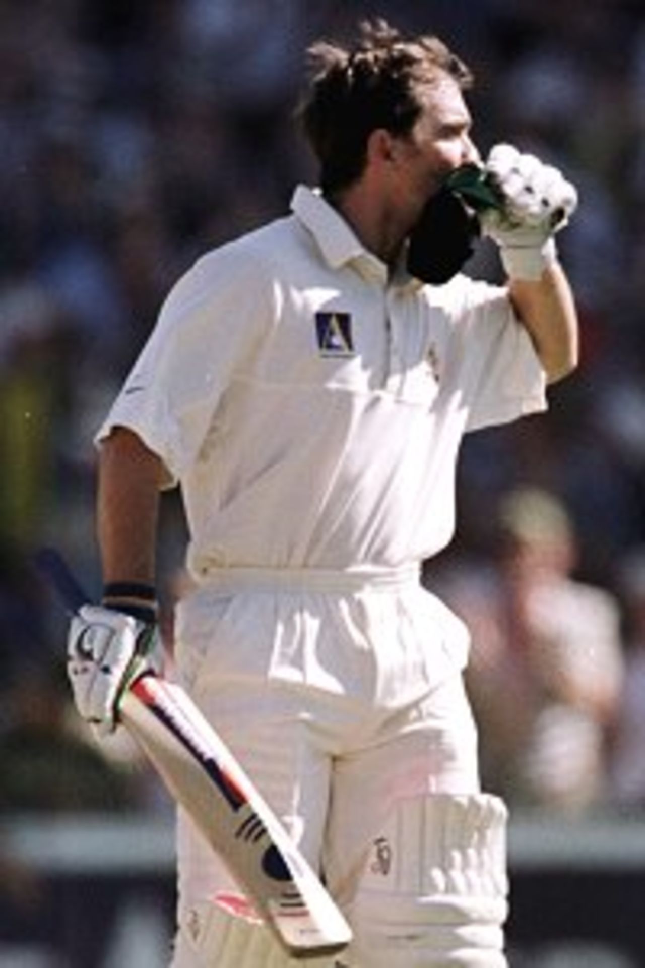 3 Jan 2000: Justin Langer of Australia celebrates his century against India by kissing the emblem on his 1900 replica cap during the second days play of the Third Test Match between Australia and India at the Sydney Cricket Ground, Sydney, Australia