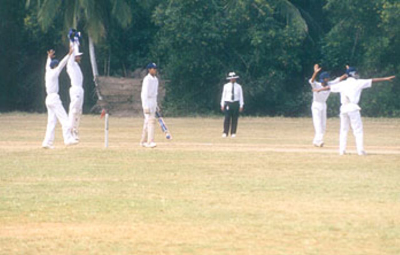 Yusuf Phathan looks on anxiously as D Phagna appeals for a catch, Vijay Merchant Trophy 1999/2000, 2nd Pre Quarter Final, Baroda Under-16s v Haryana Under-16s atLakshmibai National College of Physical Education Ground, Thiruvananthapuram, 01-03 Jan 2000