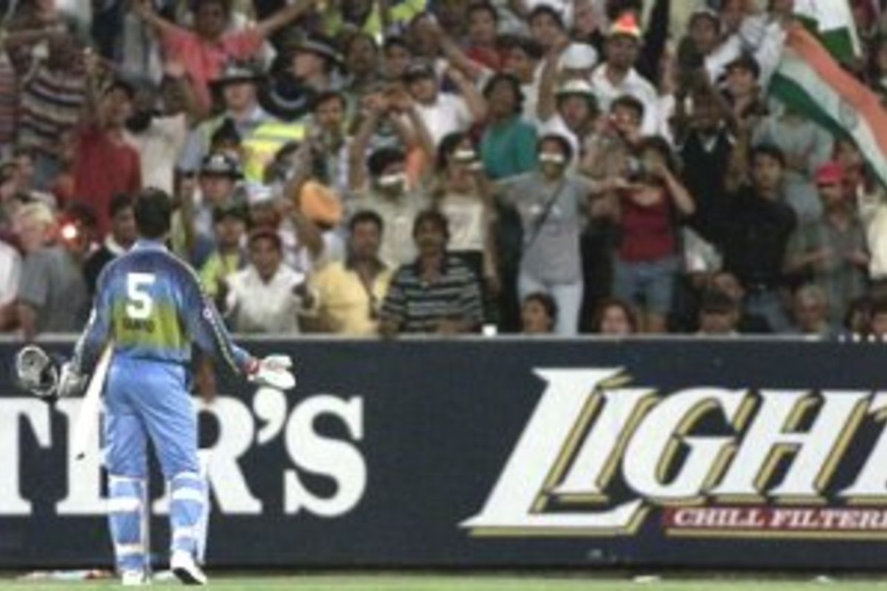 12 Jan 2000: Rahul Dravid of India appeals to the crowd to calm down after the Indian section of the crowd threw objects onto the ground after Saurav Ganguly was run out, the fans caused the game to be delayed for some time, during the one day international between Australia and India at the Melbourne Cricket Ground, Melbourne, Australia.