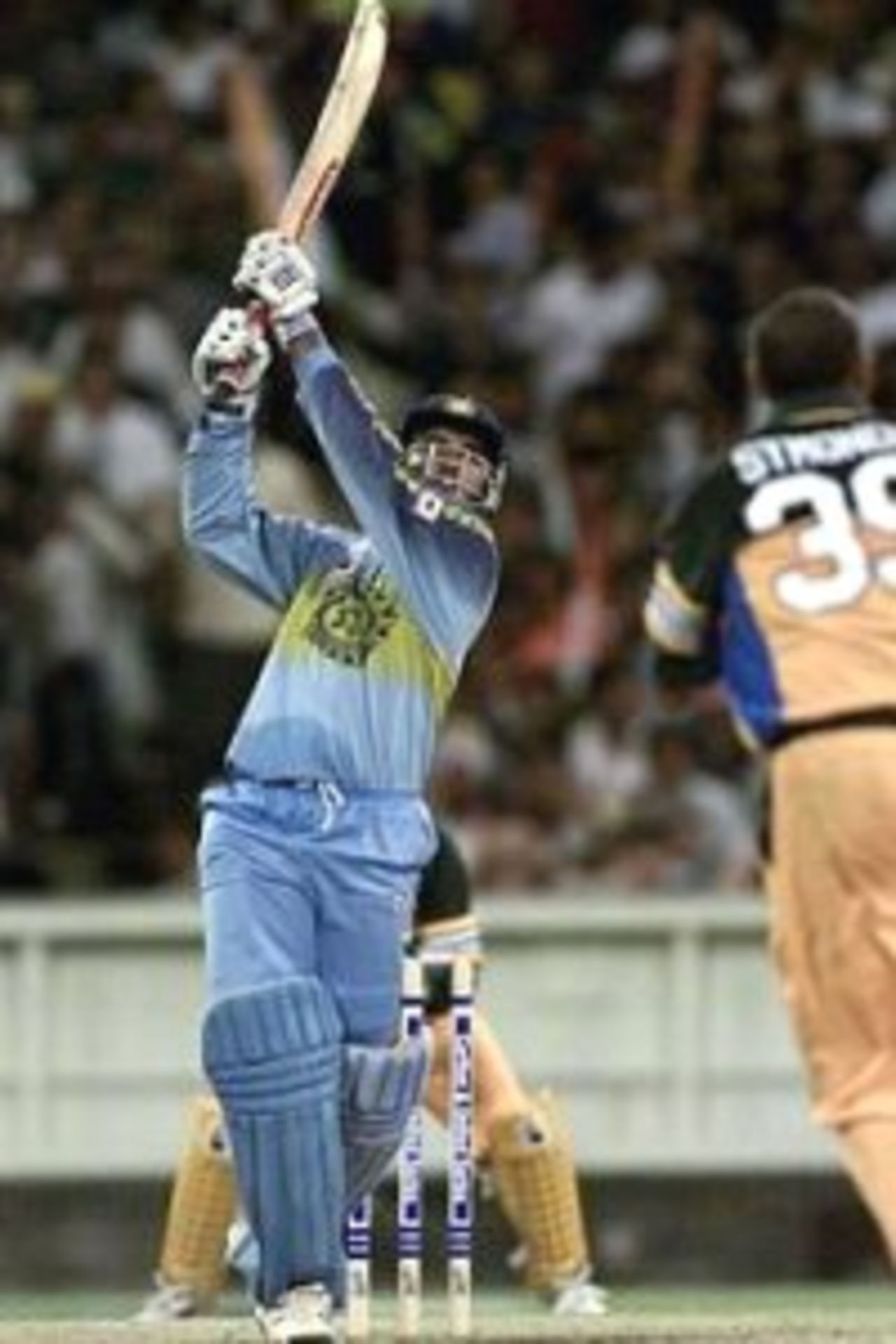 12 Jan 2000: Saurav Ganguly of India hits a big four on his way to a century during the one day international between Australia and India at the Melbourne Cricket Ground, Melbourne, Australia.