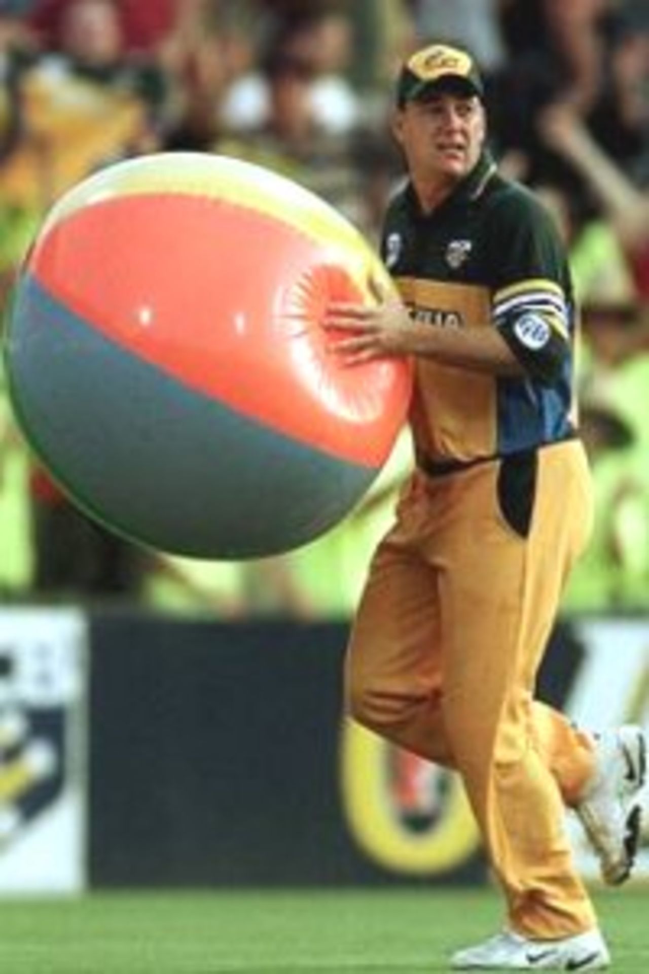 19 Jan 2000: Shane Lee of Australia throws a beach ball back to the crowd during the Carlton and United Breweries One Day International between Australia and Pakistan at The Sydney Cricket Ground, Sydney, Australia.