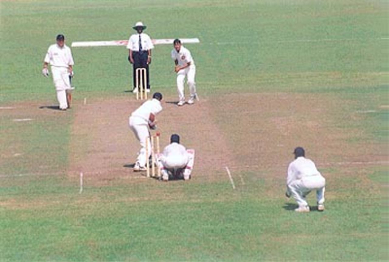 Left arm spinner Anup Dave bowling over the wicket, Under-19s World Cup, 1999/00, Super League Group 2, England Under-19s v India Under-19s, Colombo Cricket Club Ground, 20 January 2000