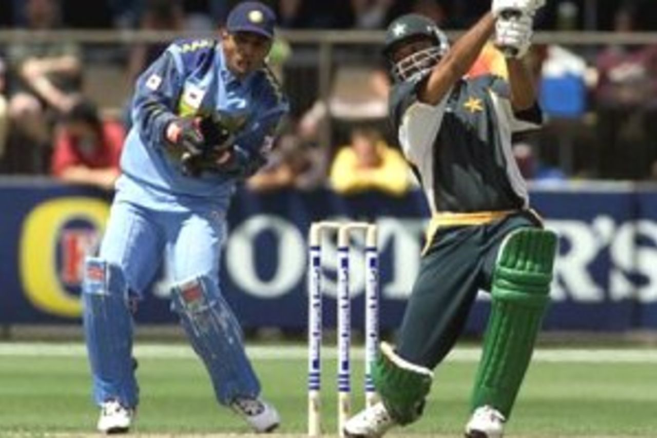 21 Jan 2000: Ijaz Ahmed of Pakistan hits out on his way to 67, with Sameer Dighe of India looking on, during the one day match between India and Pakistan at Bellerive Oval, Hobart, Australia.