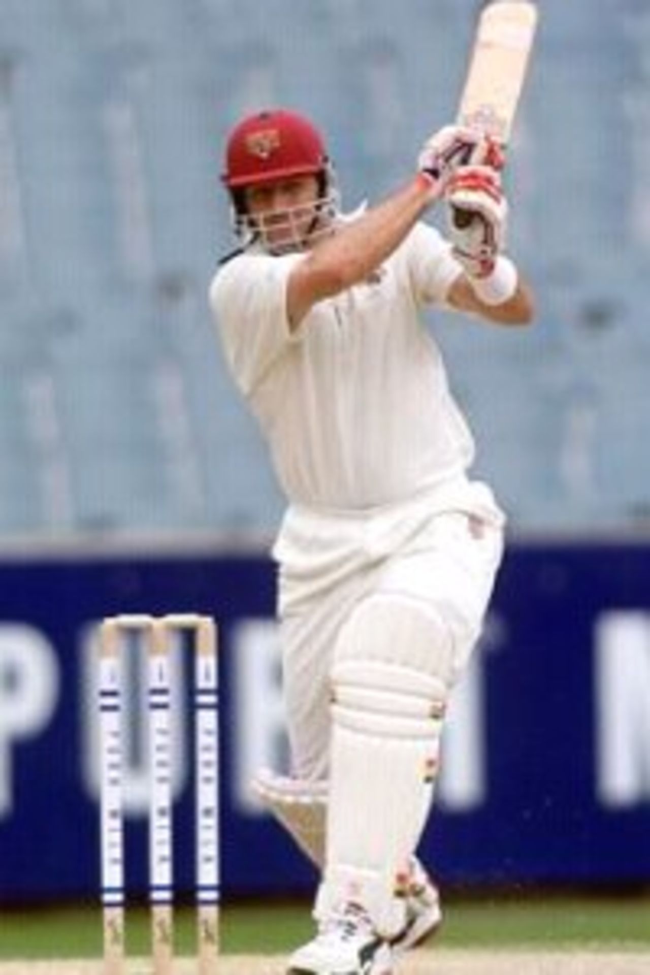29 Jan 2000: Michael Kasprowicz of Queensland hits out on his way to a half century, during the Pura Milk Cup match between Victoria and Queensland at the Melbourne Cricket Ground, Melbourne, Australia
