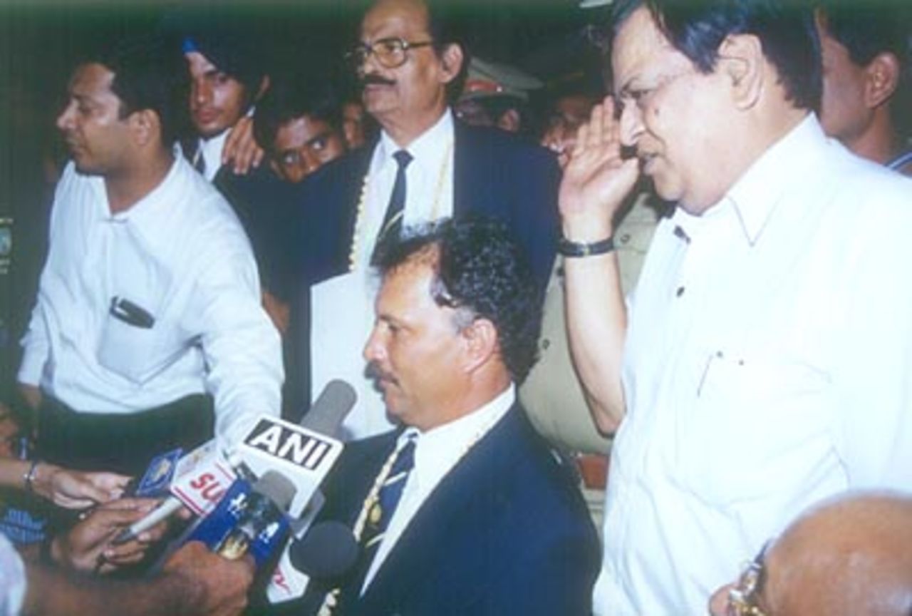 Roger Binny, the coach of Indian U19 team, talks to the press at Chennai airport, as local board officials look on, 29 Jan 2000