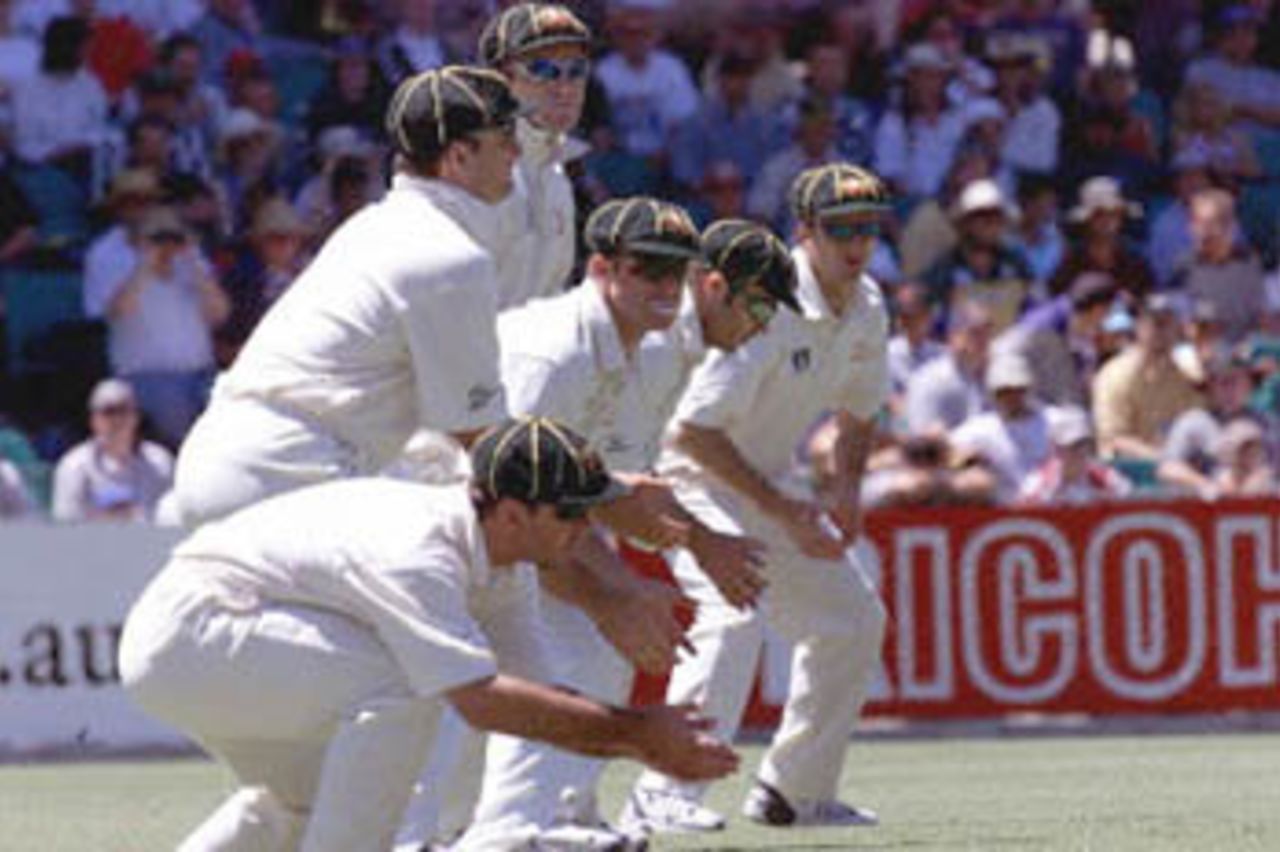 Six of the Australian team are in the slips in their specially produced baggy green federation cricket caps in the Federation test at the Sydney Cricket ground 02 January. The West Indies won the toss and elected to bat. At lunch they were 0-71.