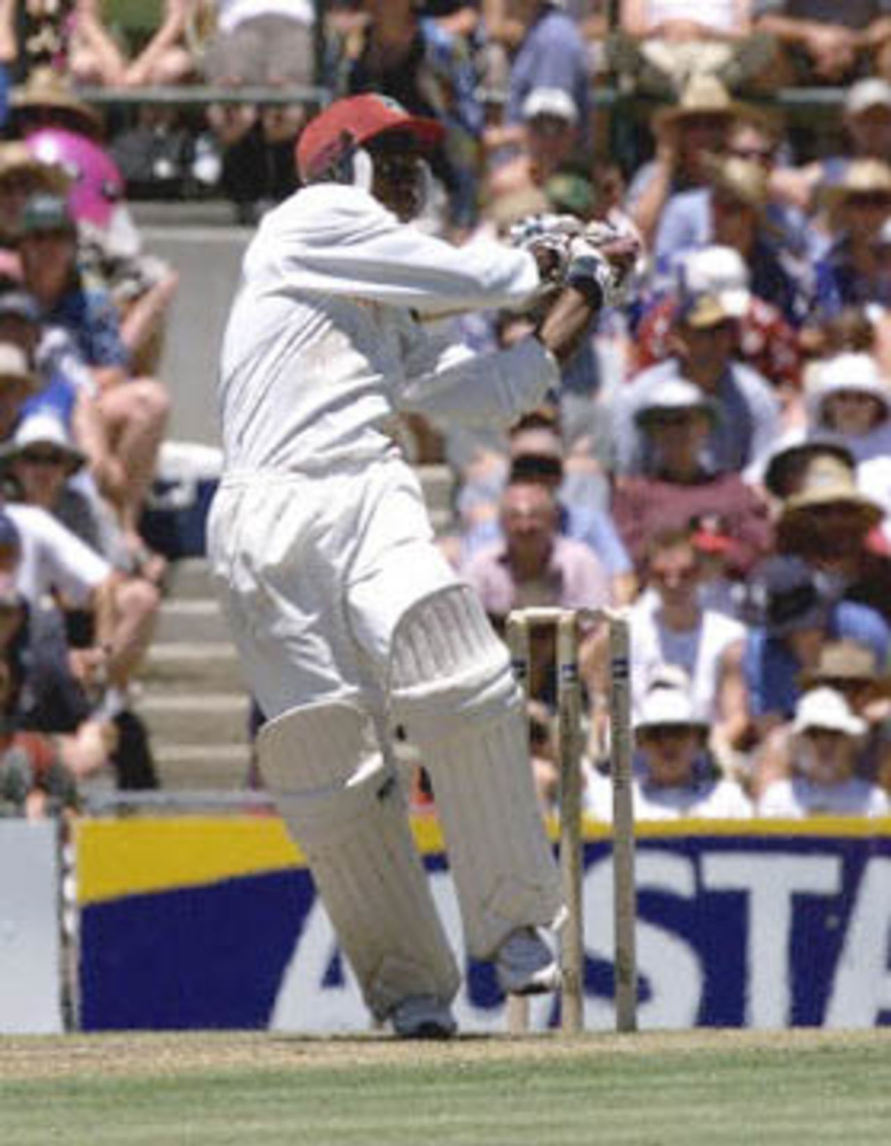 Sherwin Campbell of the West Indies slogs a ball for four off the bowling of