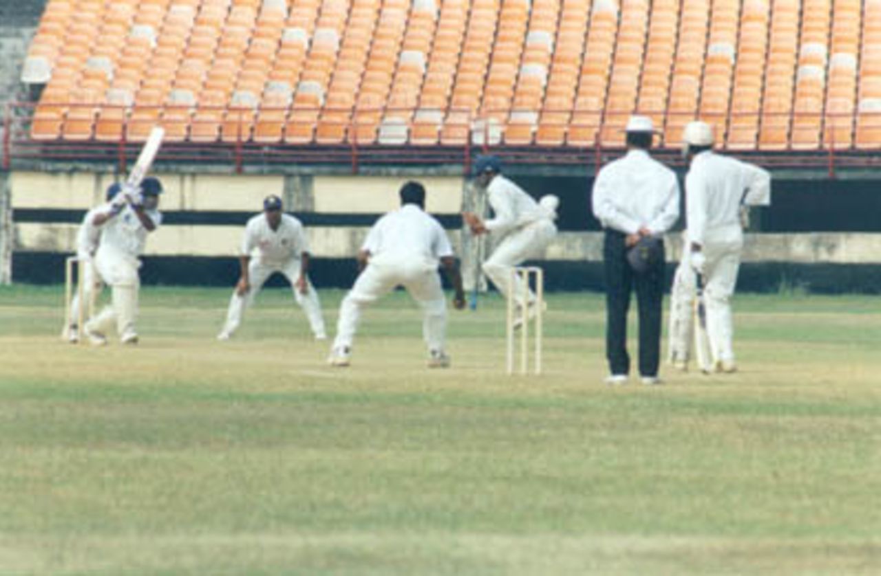Silly point fielder takes an evasive action to an off drive from Sreekumar Nair, Ranji Trophy South Zone League, 2000/01, Kerala v Tamil Nadu, Nehru Stadium, Kochi, 29Nov-02Dec 2000.