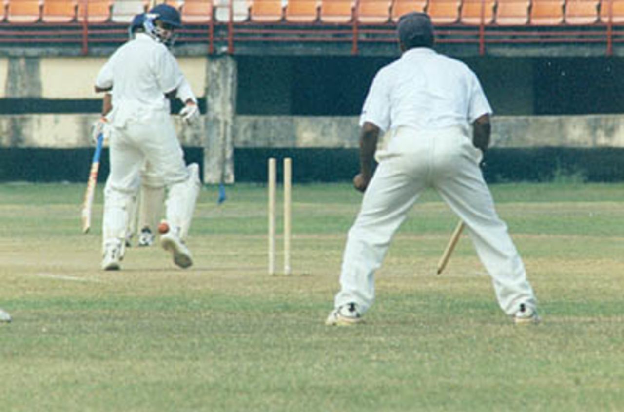 S Mahesh sends Sreekumar Nair's leg stump cart wheeling. Ranji Trophy South Zone League, 2000/01, Kerala v Tamil Nadu, Nehru Stadium, Kochi, 29Nov-02Dec 2000.