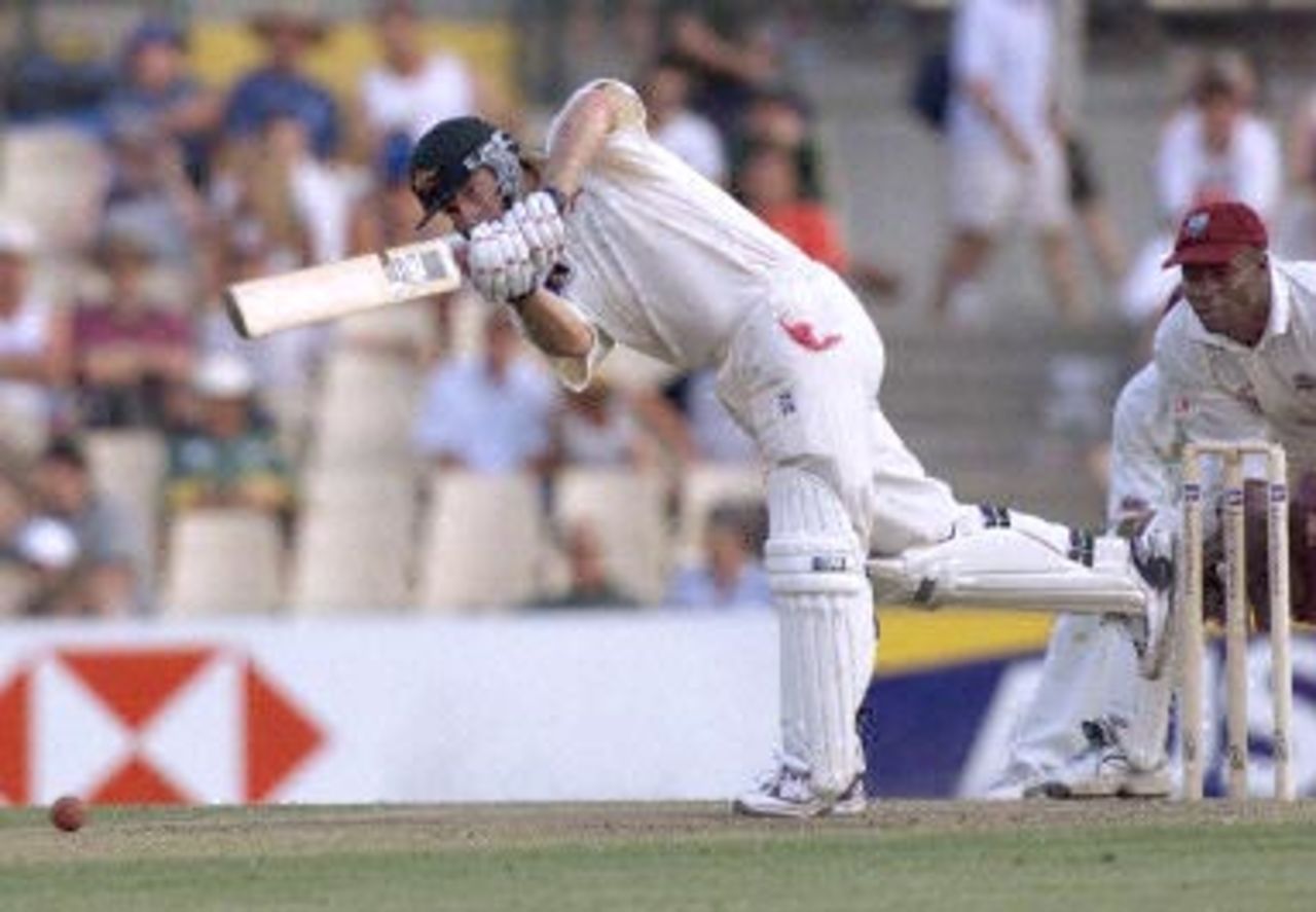 Australian captain Steve Waugh drives the ball from West Indian Captain Jimmy Adams in the Federation test at the Sydney Cricket ground, 03 January 2001. At close of the second  day Australia were 4/284 with six wickets in hand after the West Indies were all out for 272.