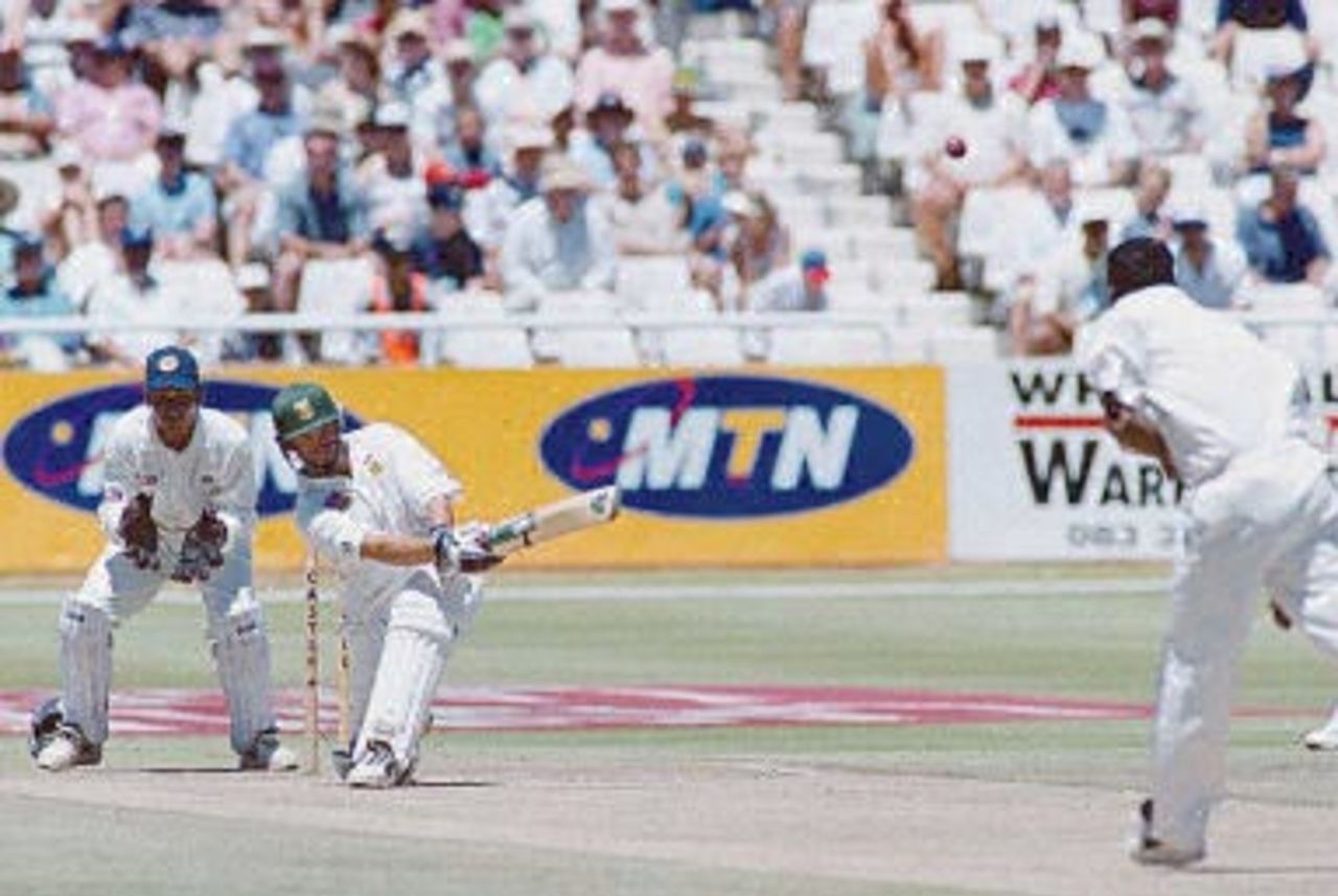 South African batsman Neil McKenzie hits Sri Lanka's Mutiah Muralitharan for six on the 2nd of the second five day cricket test between South Africa and Sri Lanka played at Newlands cricket ground in Cape Town 03 January 2001.