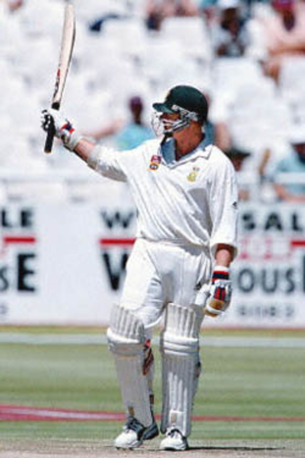 South African batsman Lance Klunser celebrates his 50 runs 04 January 2001 during the third day of the second test between South Africa and Sri Lanka played at the Newlands cricket ground in Cape Town.