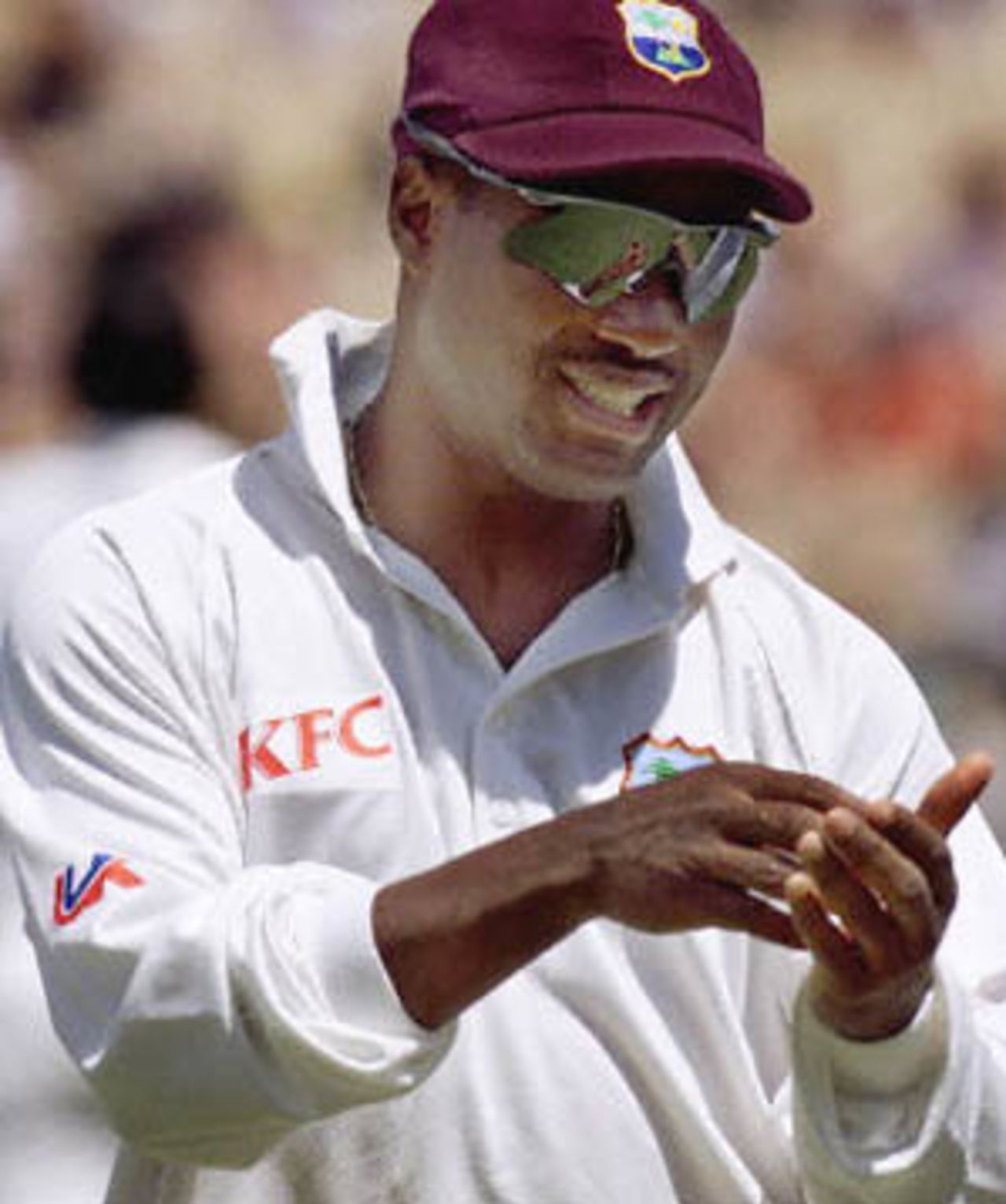 Star all-rounder for the West Indies Brian Lara leaves the field with an injured hand after he caught Adam Gilchrist for 87 off the bowling of Colin Stuart in the Federation test at the Sydney Cricket ground 04 January 2001. At the end of the innings Australia lead by 180 runs.