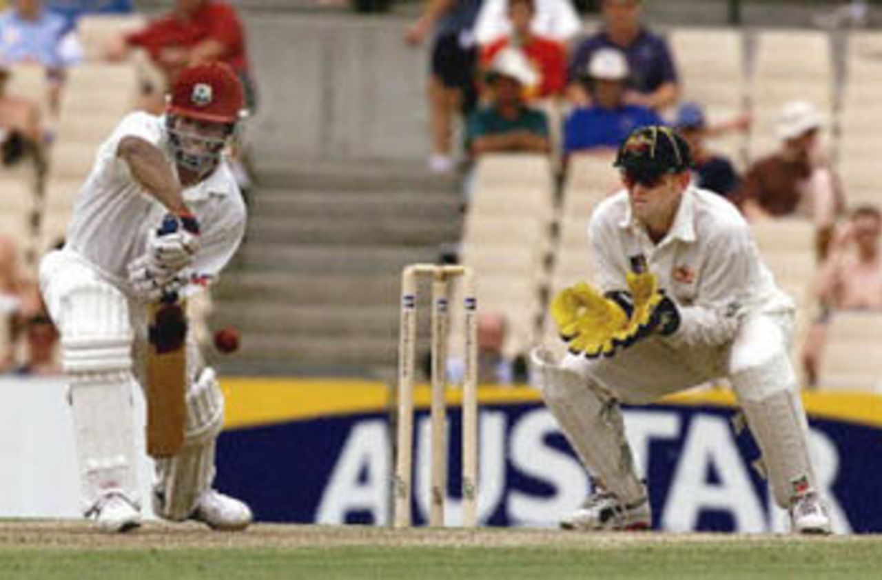 Star West Indies batsman Brian Lara cuts a ball from Colin Miller that is caught by Australian wicket-keeper Adam Gilchrist in the Federation test at the Sydney Cricket ground 05 January 2001. Lara made 20 runs and the West Indies is currently 5-174 in the second innings.