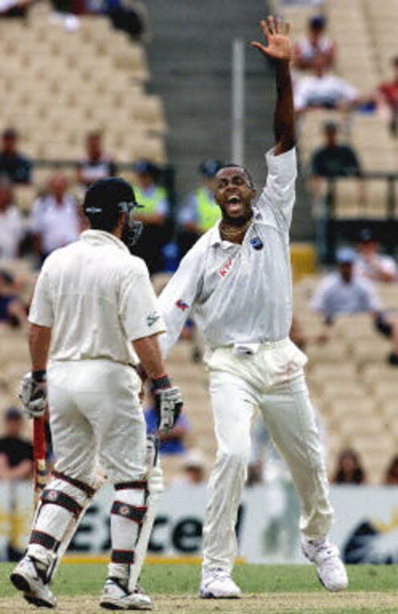 West Indian fast bowler Courtney Walsh jubilates after taking the wicket LBW of Australian Justin Langer in the Federation test at the Sydney Cricket ground 05 January 2001. It was Walsh's 494th wicket and Langer made 10 runs.