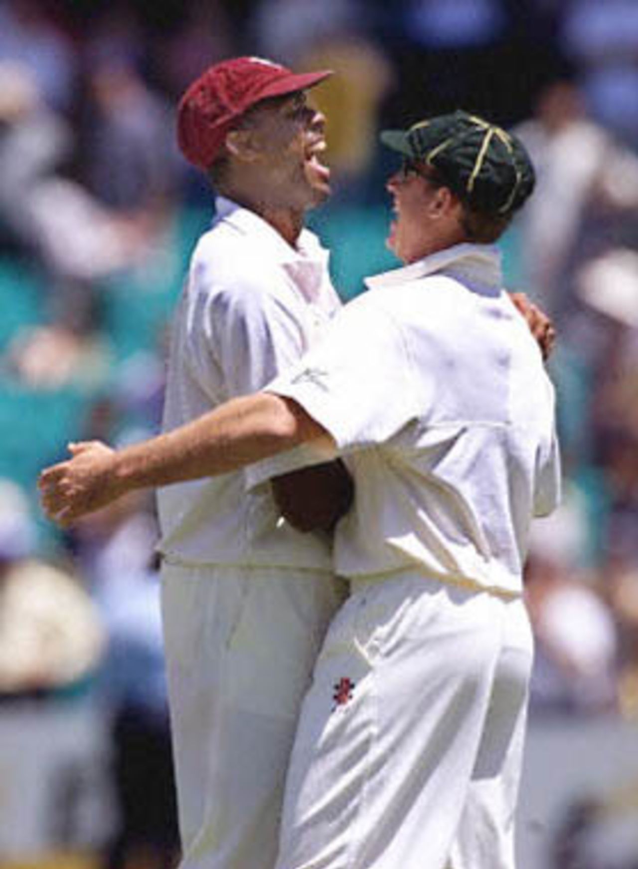 West Indian fast bowler Courtney Walsh (L) shares a close moment with Australian captain Steve Waugh (R) after Australia won the Sir Frank Worrell cup at the Sydney Cricket ground 06 January 2001. Australia won the five day test with 7 wickets in hand.