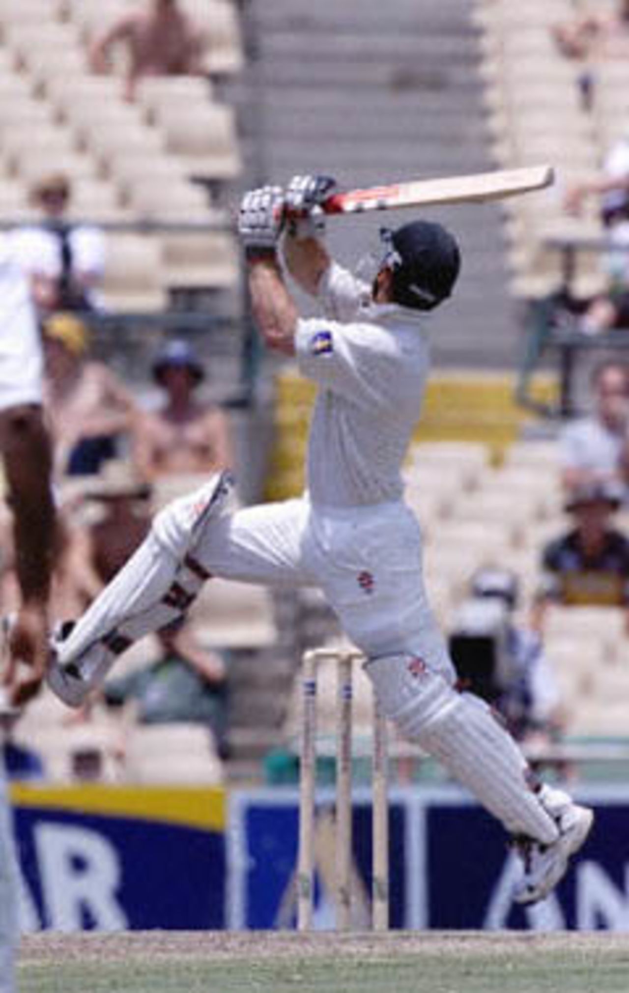 Australian batsman Michael Slater takes an unusual swipe at the ball in the fifth Test at the Sydney Cricket Ground, 06 January 2001. Slater smashed 86 to steer Australia to a six-wicket victory over the West Indies in the fifth Test to clinch a 5-0 series clean sweep and their 15th consecutive Test win.