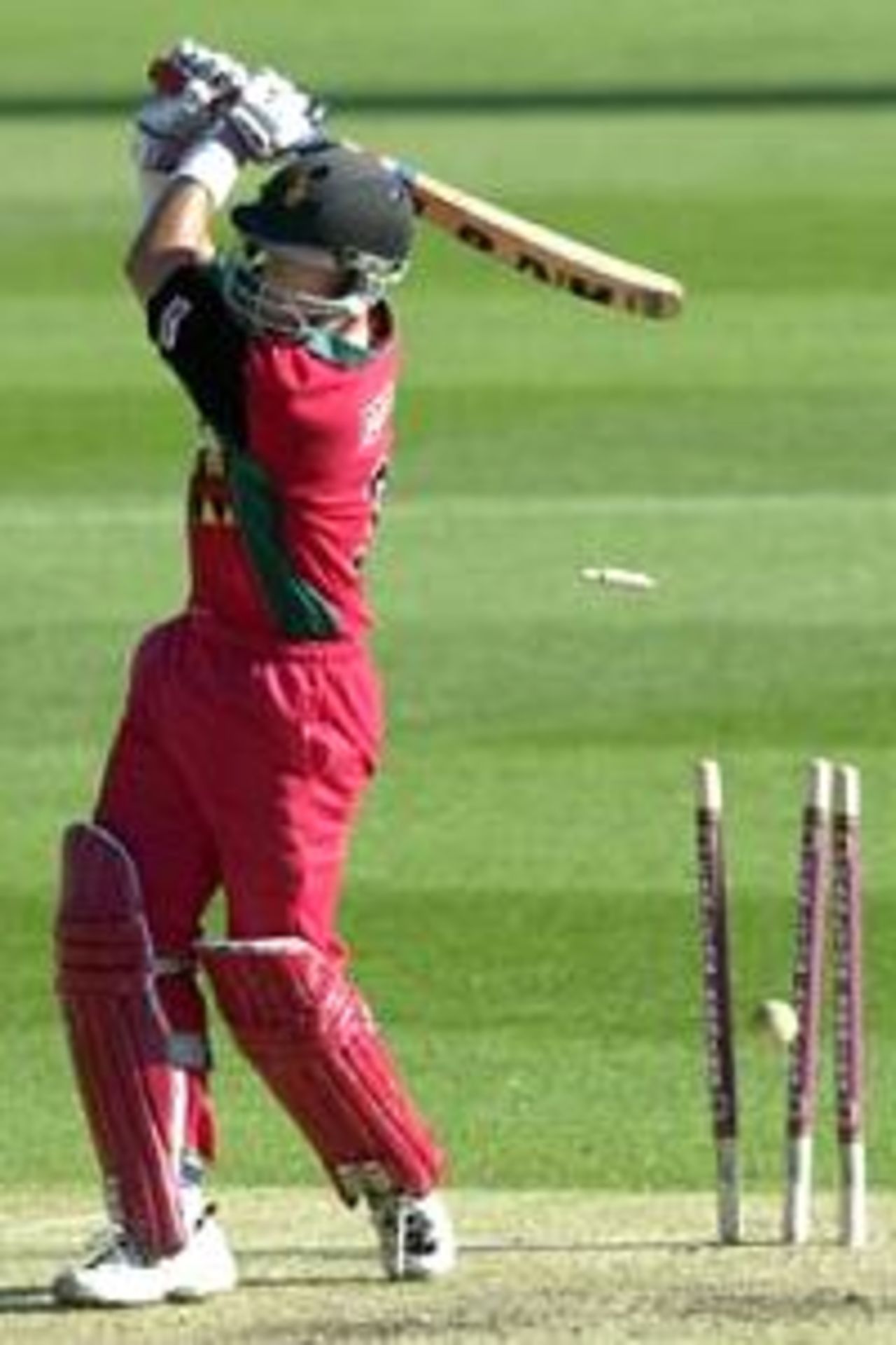 13 Jan 2001: Gavin Rennie of Zimbabwe is bowled by Nixon McLean of West Indies for 29 during the Carlton Series limited over game between Zimbabwe and West Indies at The Gabba cricket ground in Brisbane, Australia.