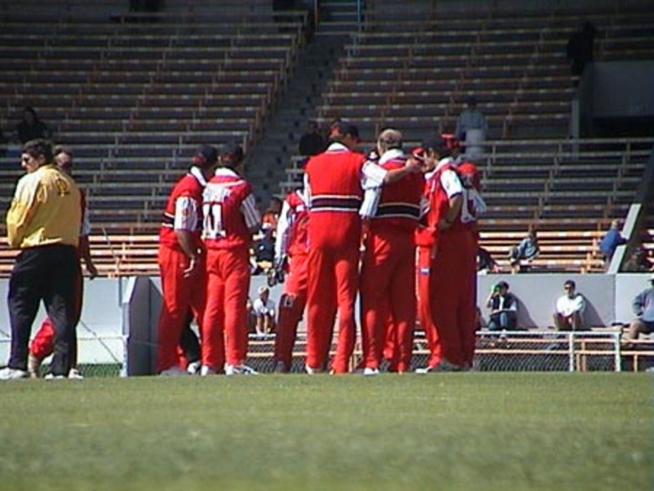 Members of the Canterbury team huddle after snaring an Otago wicket, Shell Cup: Canterbury v Otago at Jade Stadium, Christchurch, 16 January 2001