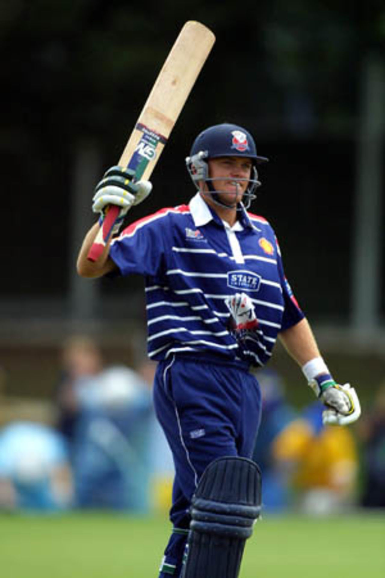 Auckland batsman Lou Vincent raises his bat to the crowd upon reaching his second Shell Cup century, before going on to make an unbeaten 133, Shell Cup: Auckland v Northern Districts at Eden Park Outer Oval, Auckland, 18 January 2001