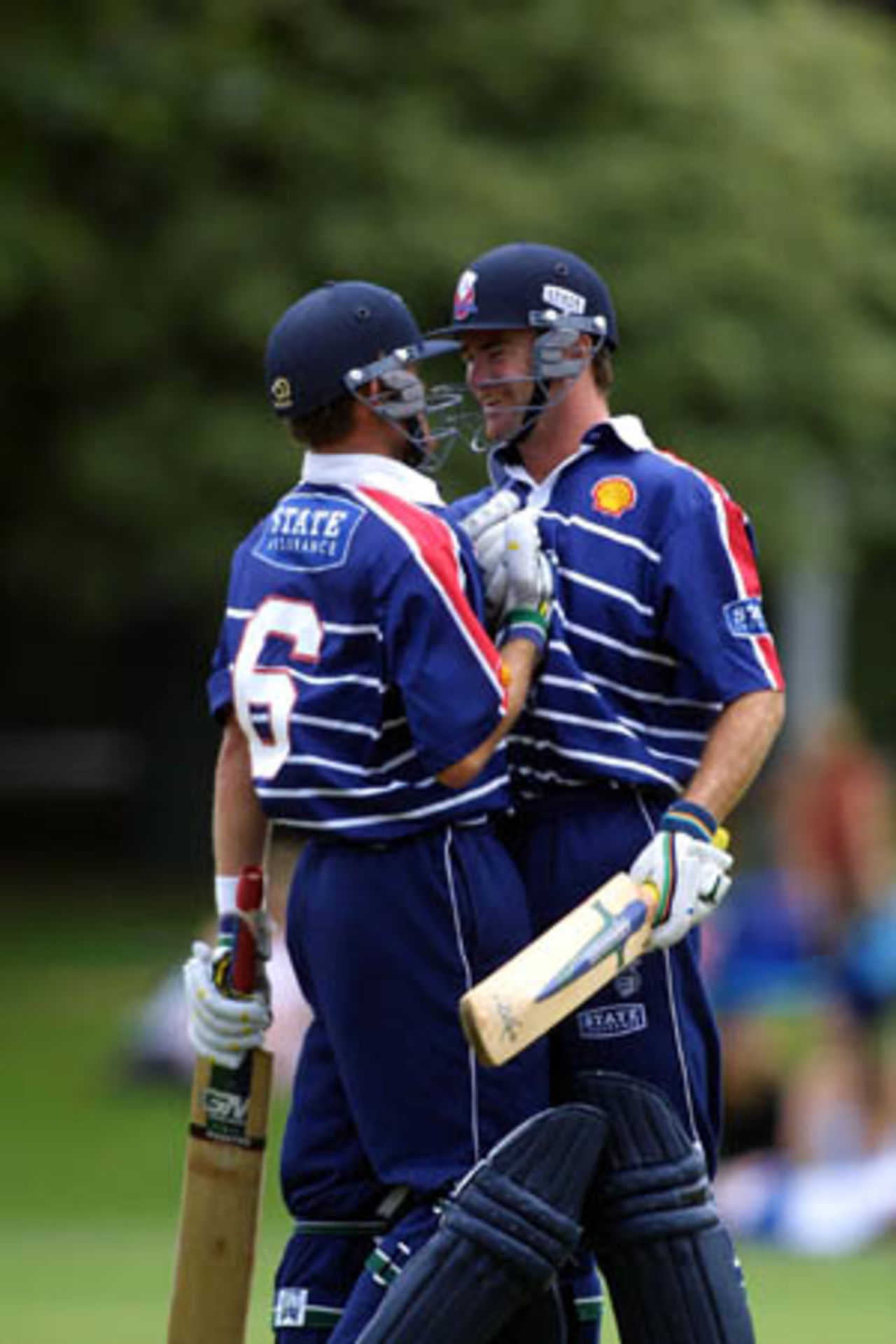 Auckland captain congratulates batting partner Lou Vincent upon reaching his second Shell Cup century, Shell Cup: Auckland v Northern Districts at Eden Park Outer Oval, Auckland, 18 January 2001