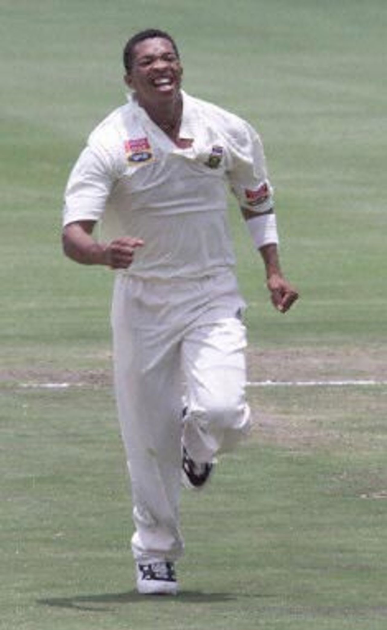 South African bowler Makhaya Ntini celebrates the wicket of Mahela Jayawardene on the second day of the third and final Test between South Africa and Sri Lanka at Centurion Park 21 January 2001.