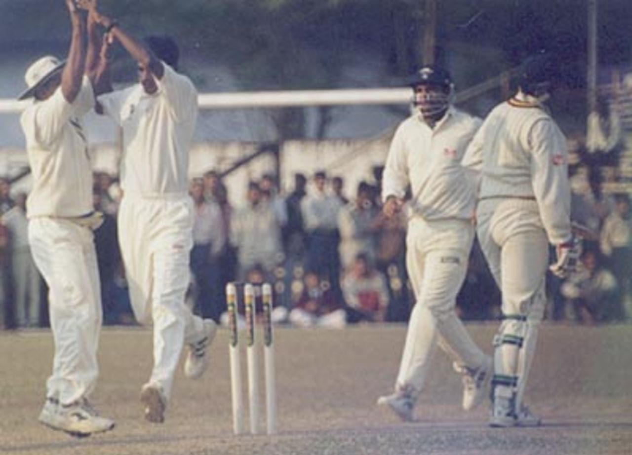 The Assam teammates celebrate the fall of Pradeep Das. Ranji Trophy East Zone League 2000-01, Assam v Orissa Tinsukia District Sports Association Stadium, 4-6 Jan 2001