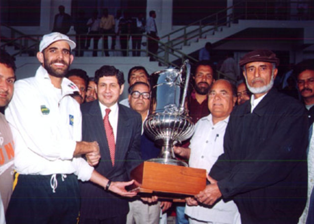 Captain of the winning team being presented the coveted trophy, Quaid-e-Azam Trophy Grade-I Final, Karachi Cricket Association v Lahore Cricket Association Blues at Karachi, 20-24 Jan 2001
