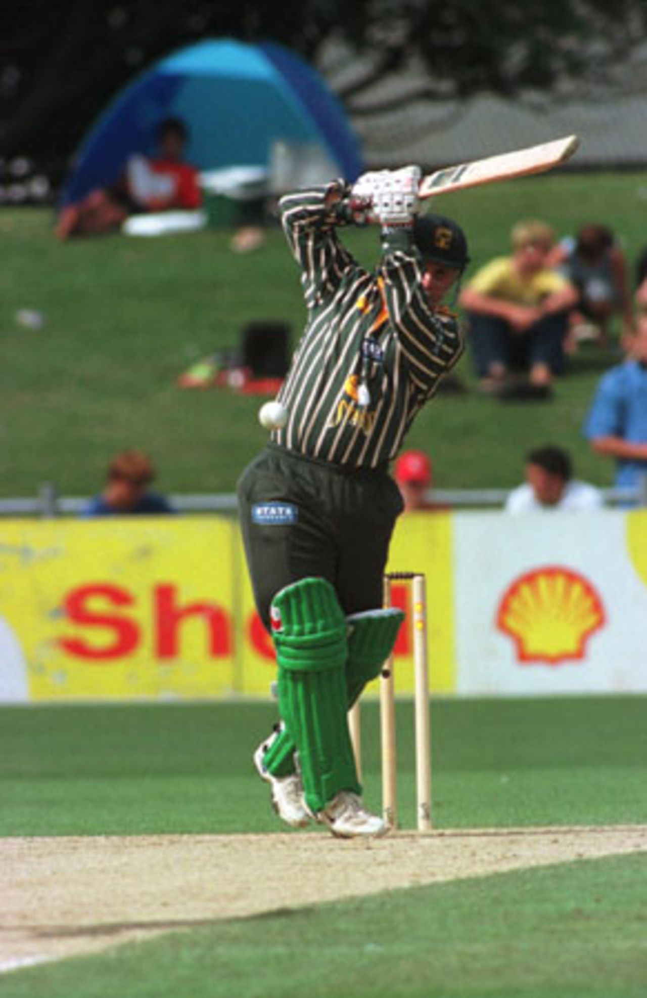 Central Districts batsman Mark Douglas drives in the air back down the ground during his innings of 20. 1st Shell Cup Final: Central Districts v Canterbury at McLean Park, Napier, 24 January 2001.