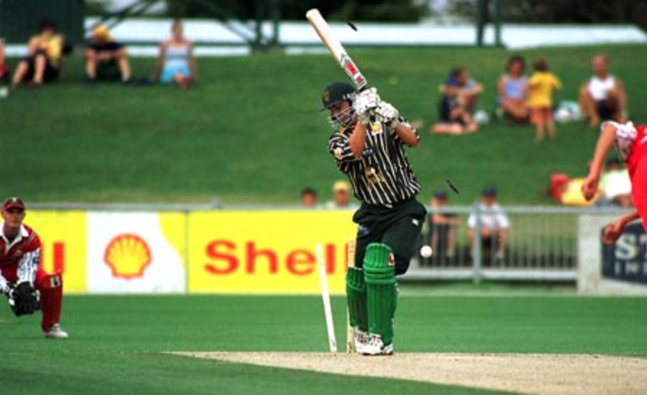 Central Districts opening batsman Mathew Sinclair is clean bowled by Canterbury pace bowler Chris Martin for 2. Wicket-keeper Gareth Hopkins looks on. 1st Shell Cup Final: Central Districts v Canterbury at McLean Park, Napier, 24 January 2001.