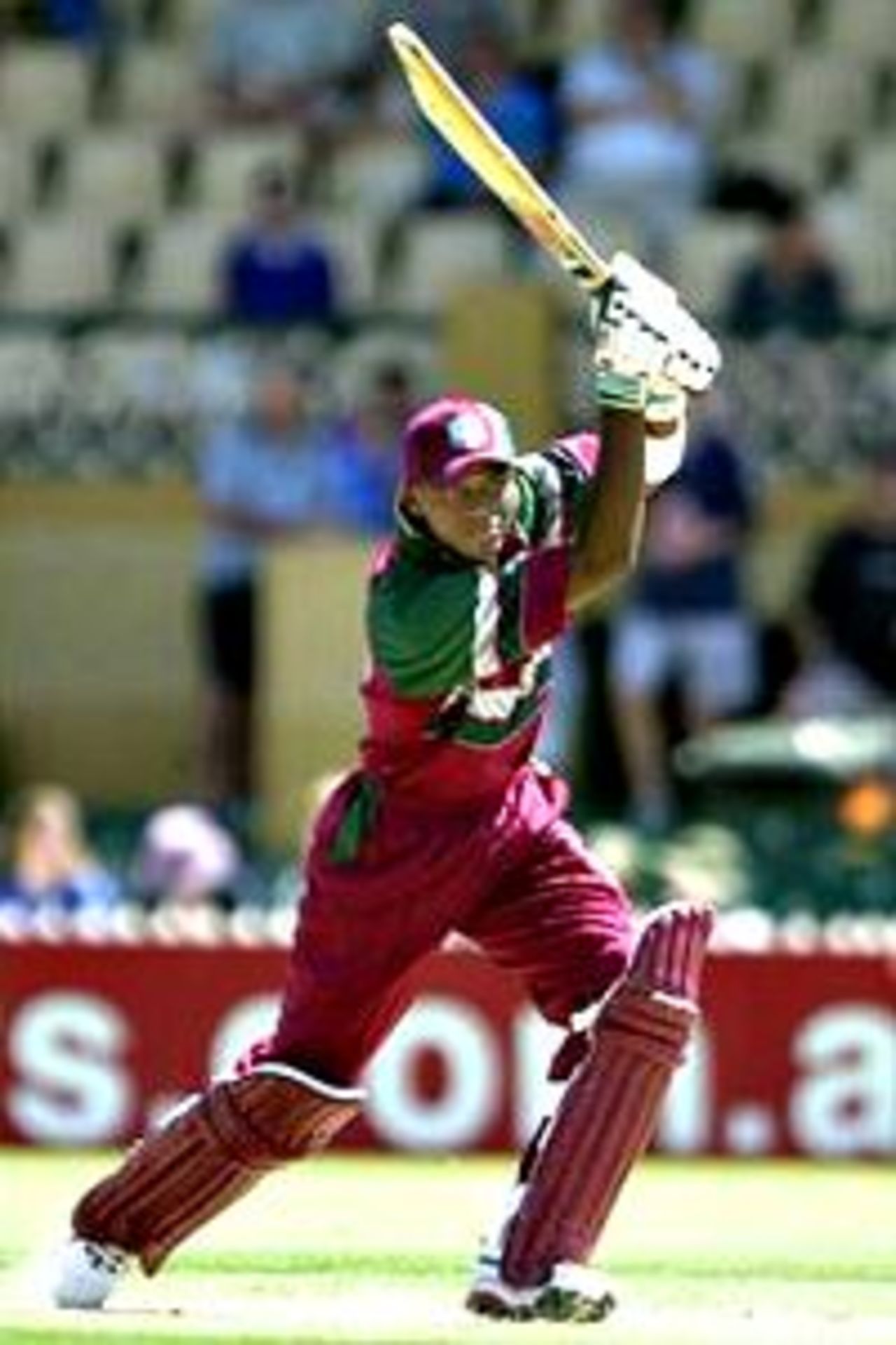 25 Jan 2001: Marlon Samuels of the West Indies drives through cover point against Zimbabwe during the Carlton Series One Day International between West Indies and Zimbabwe at the Adelaide Oval in Adelaide, Australia.